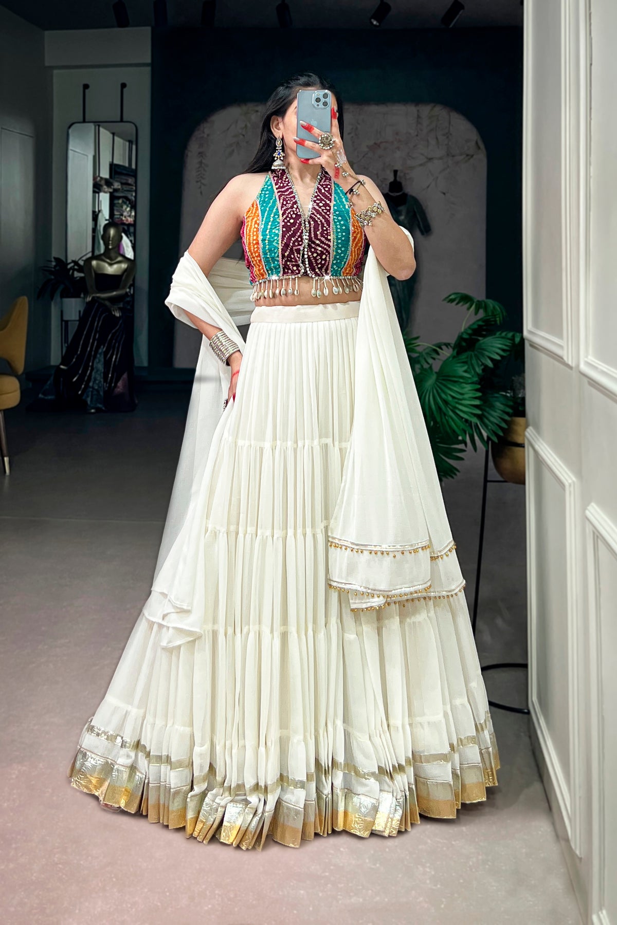 Ivory Tiered Navratri Garba Special Lehenga With Bandhani Mirror Work Blouse