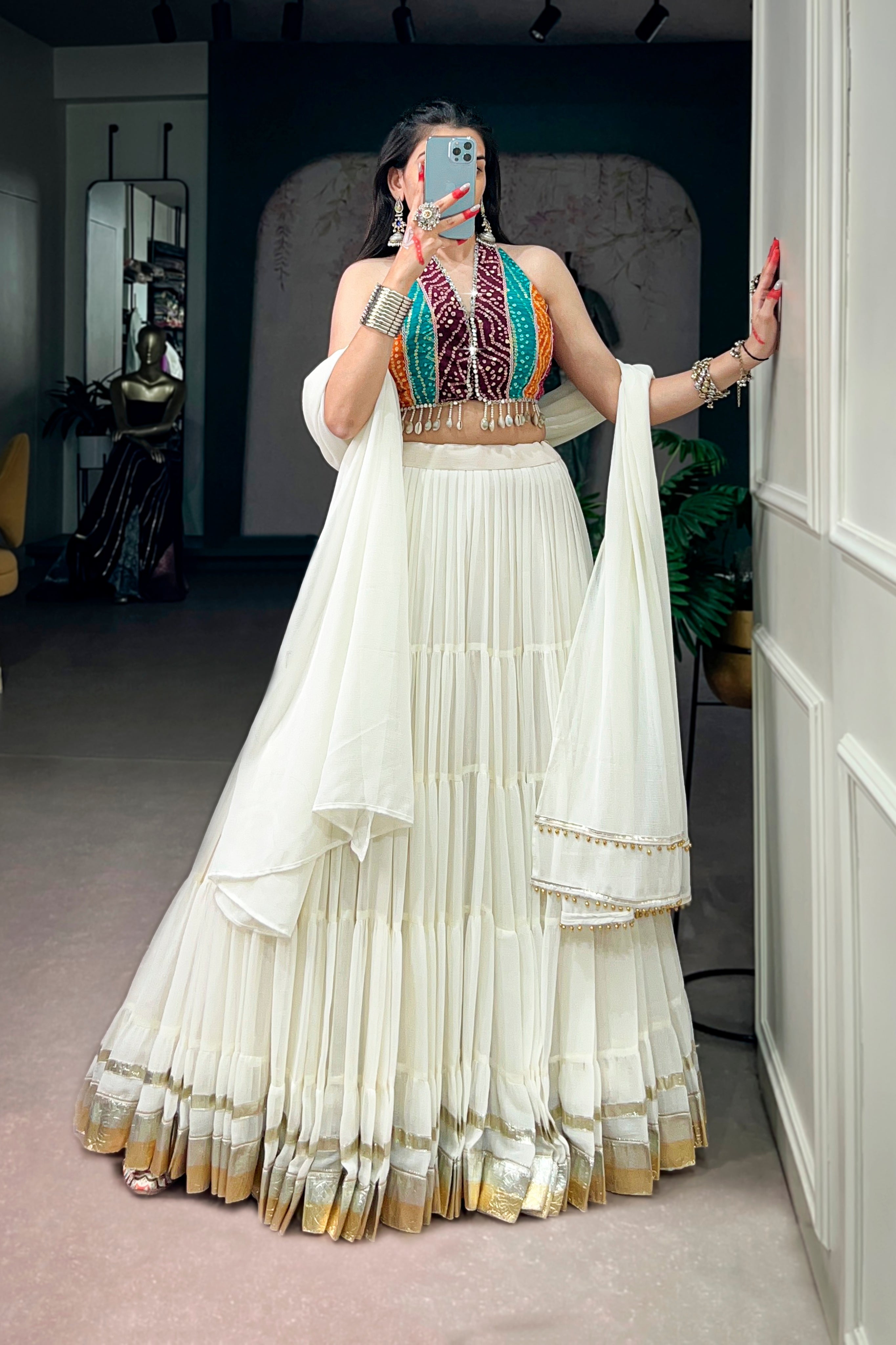 Ivory Tiered Navratri Garba Special Lehenga With Bandhani Mirror Work Blouse