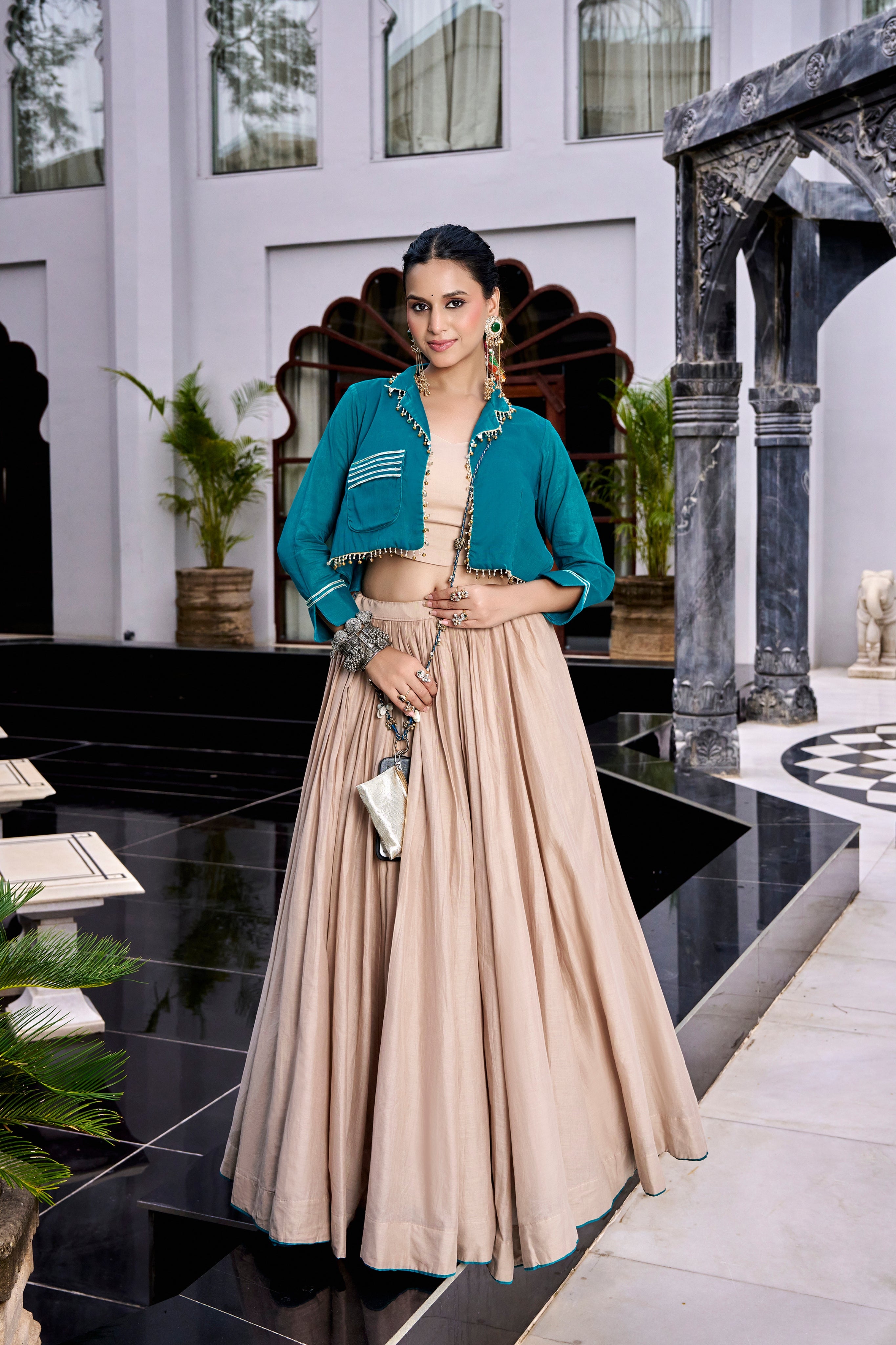 Teal Jacket-Style Crop Top With Beige Flared Lehenga And Matching Purse