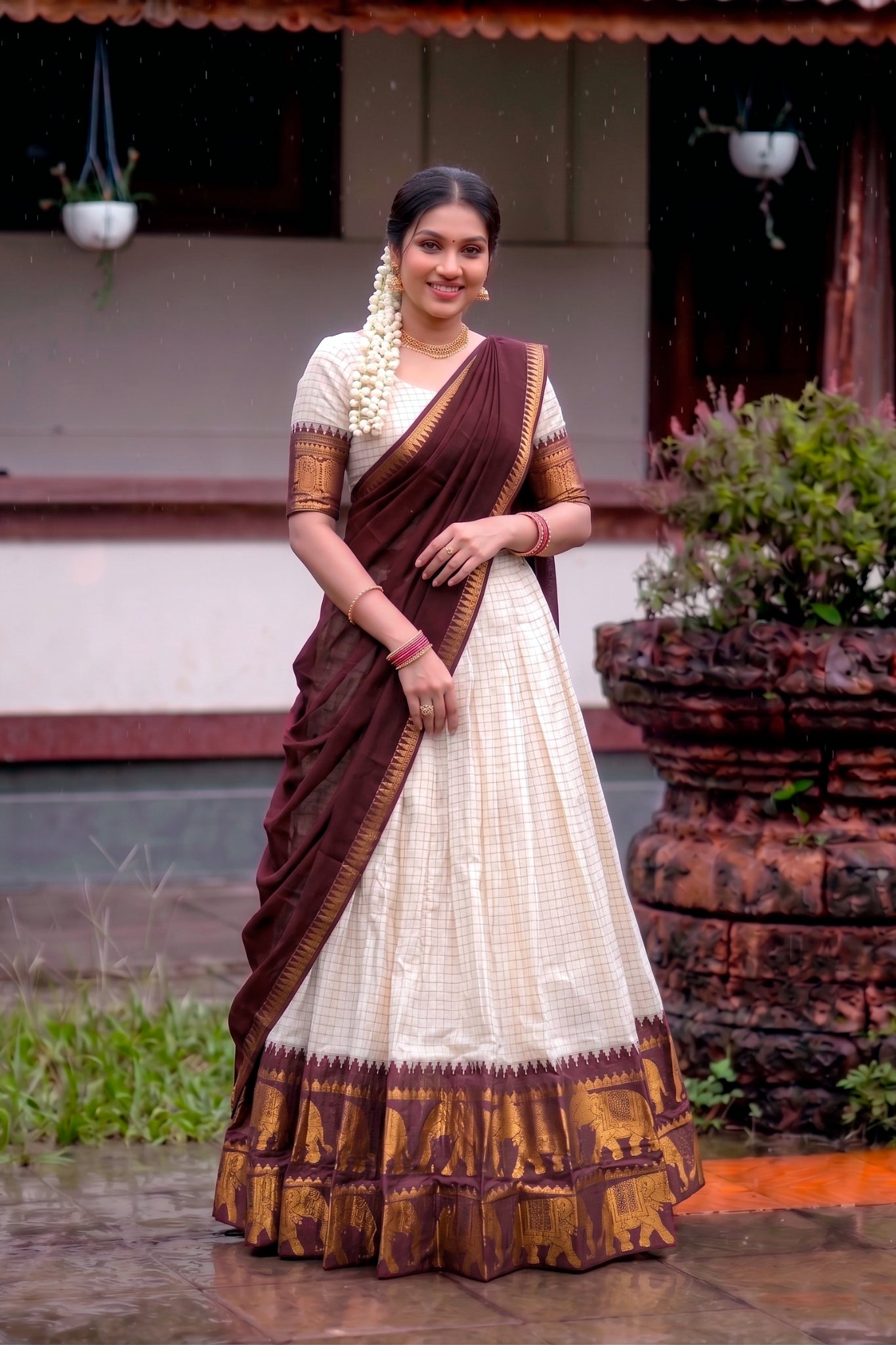Woman in a traditional lehenga standing outdoors