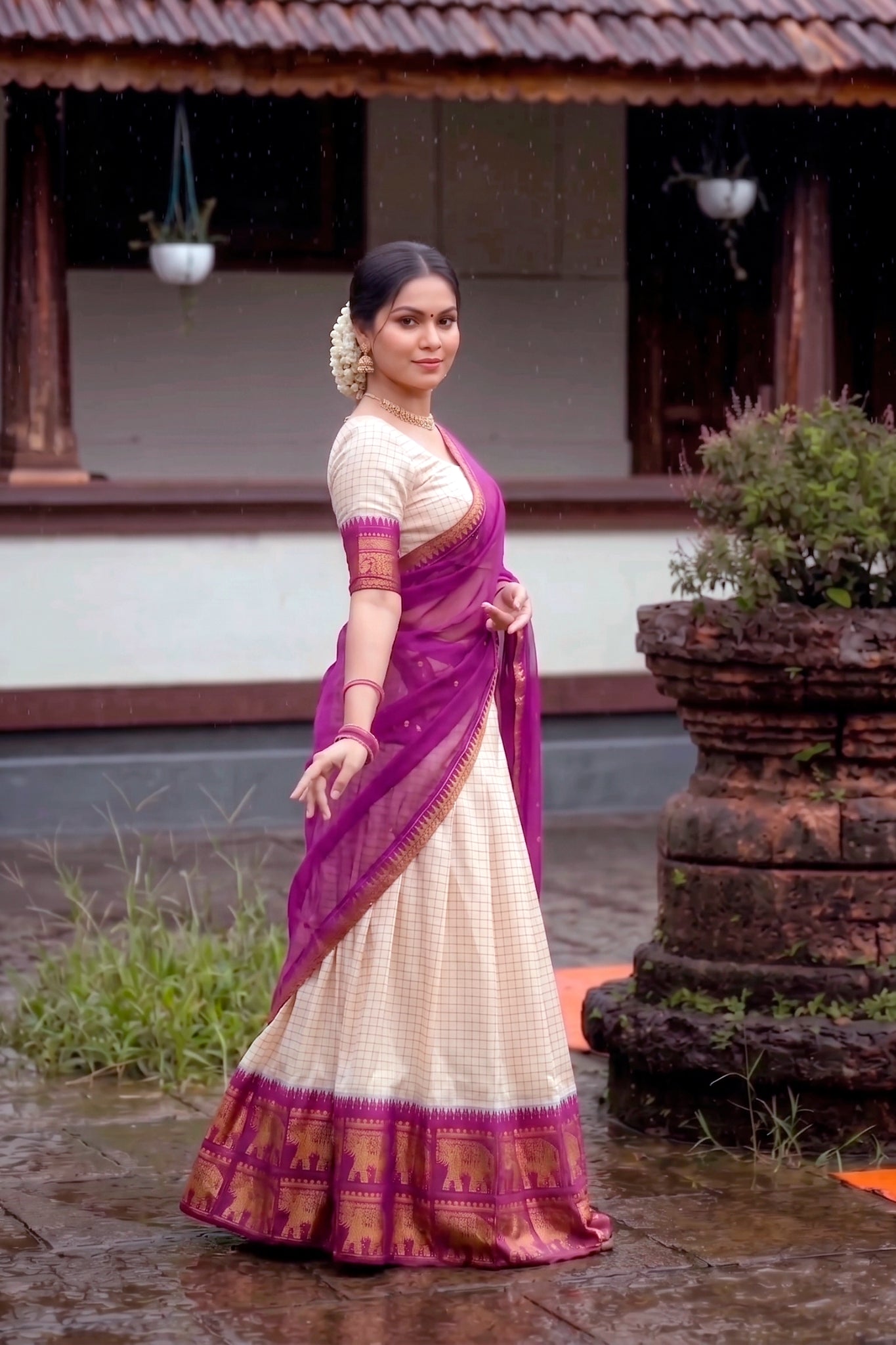 Woman in a traditional lehenga choli standing outdoors