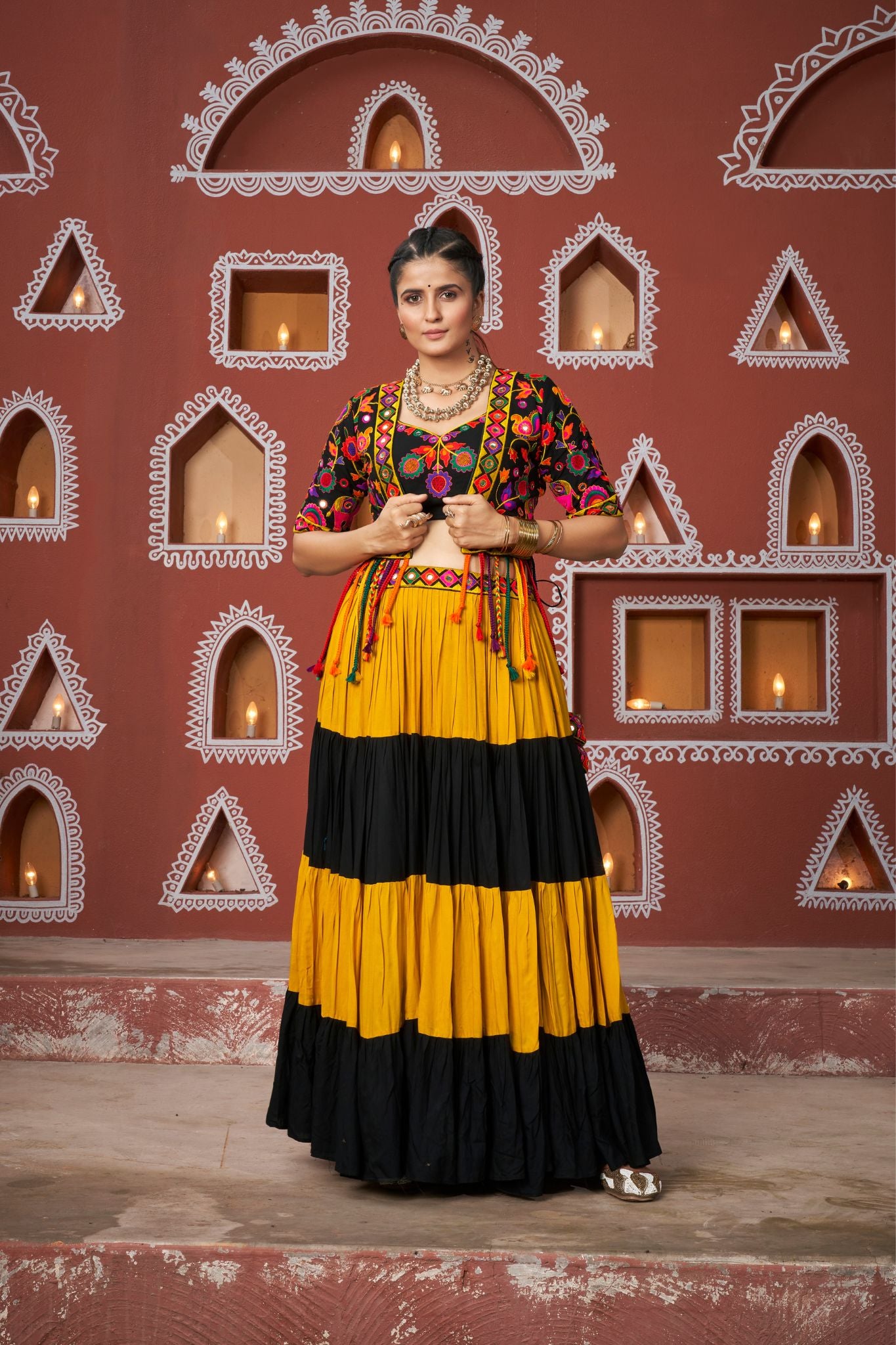 Orange And Black Tier Fancy Navratri Lehenga Choli