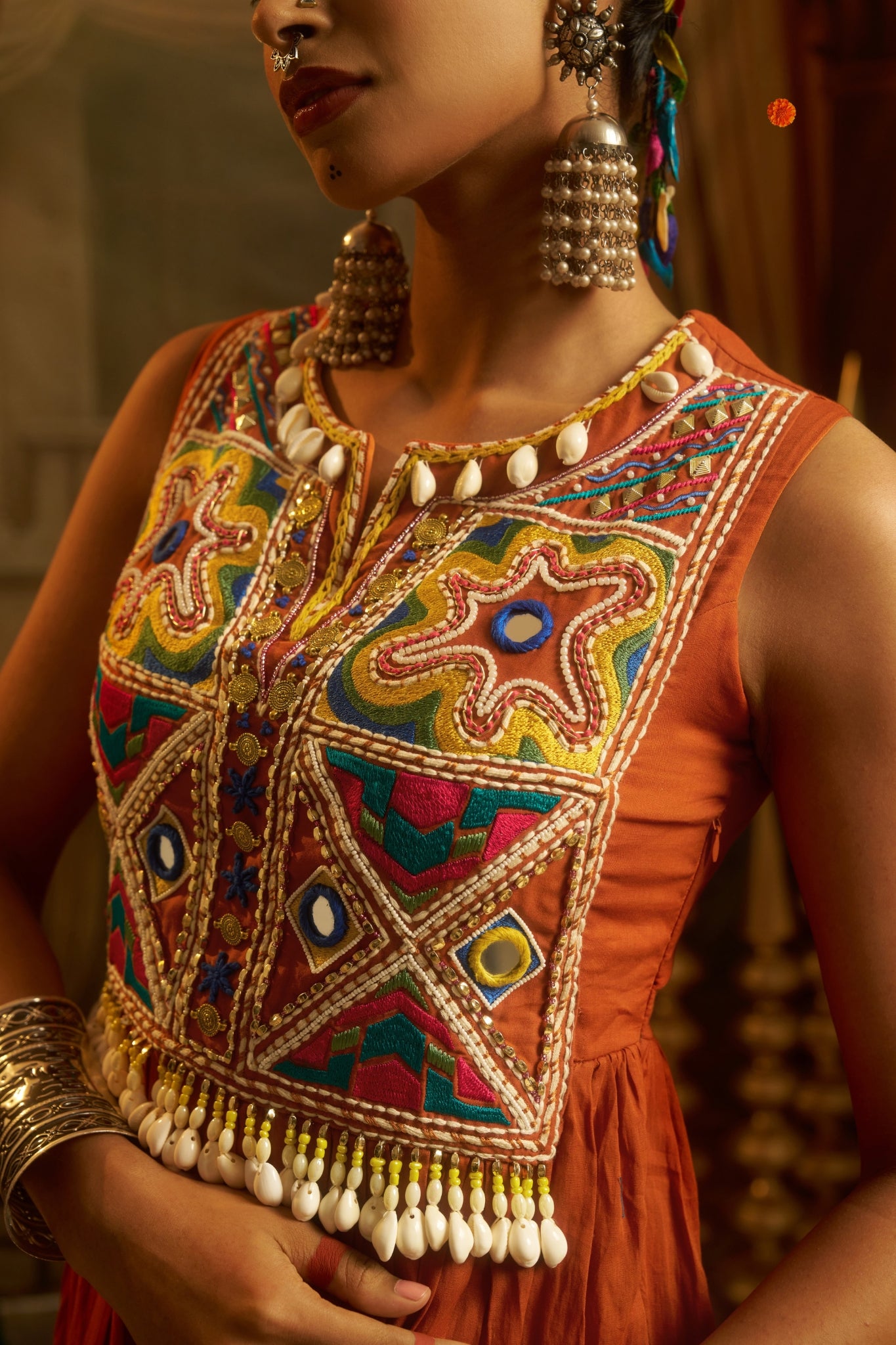 Rust Orange Tiered Anarkali Dress With Hand Embroidered Yoke & Cowrie Shell Fringe
