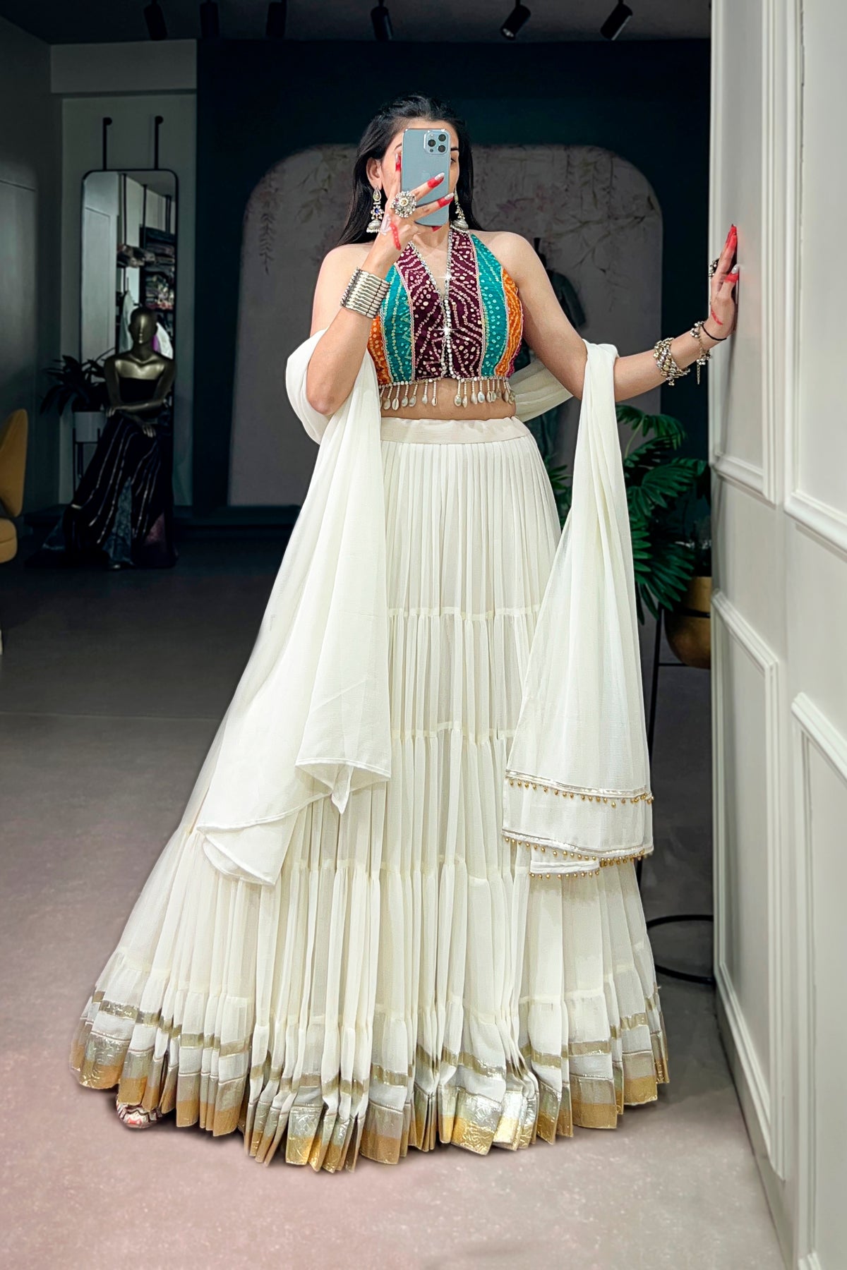 Ivory Tiered Navratri Garba Special Lehenga With Bandhani Mirror Work Blouse