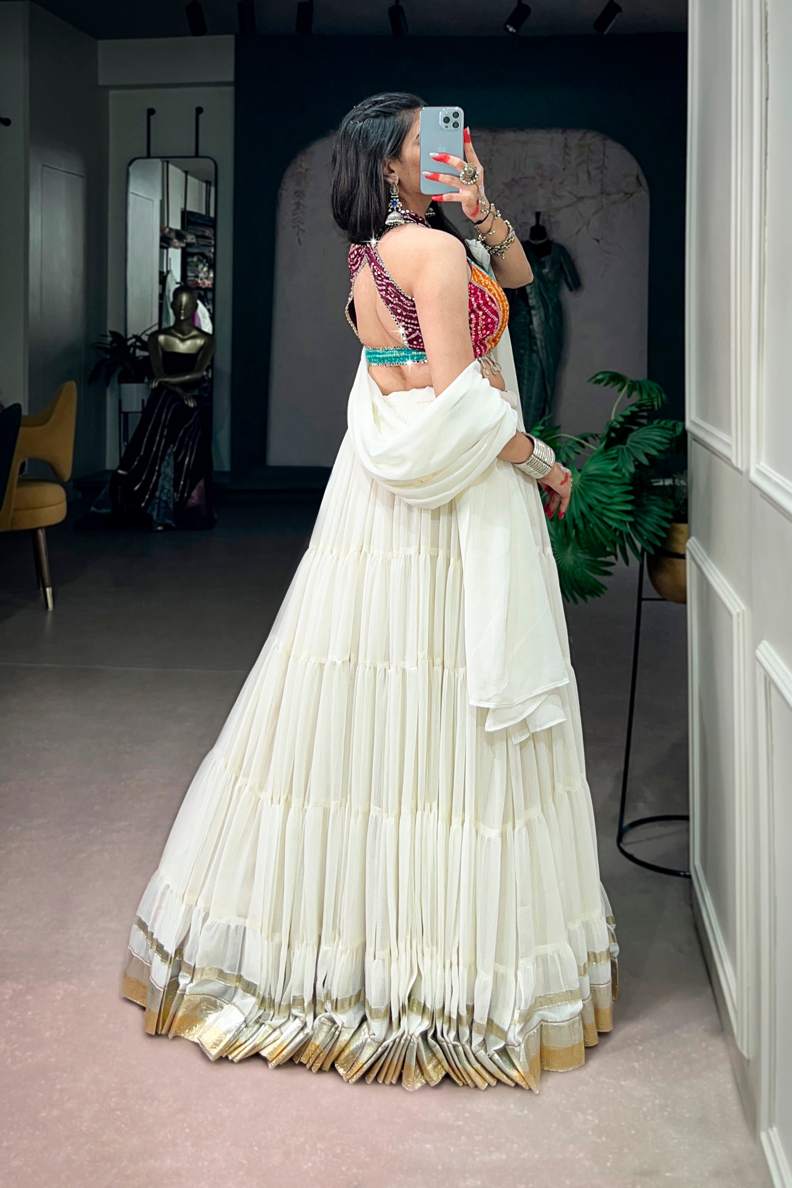Ivory Tiered Navratri Garba Special Lehenga With Bandhani Mirror Work Blouse
