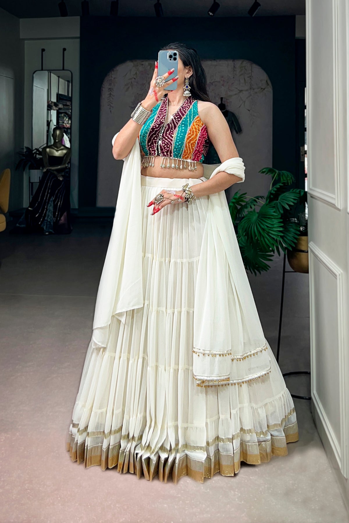 Ivory Tiered Navratri Garba Special Lehenga With Bandhani Mirror Work Blouse