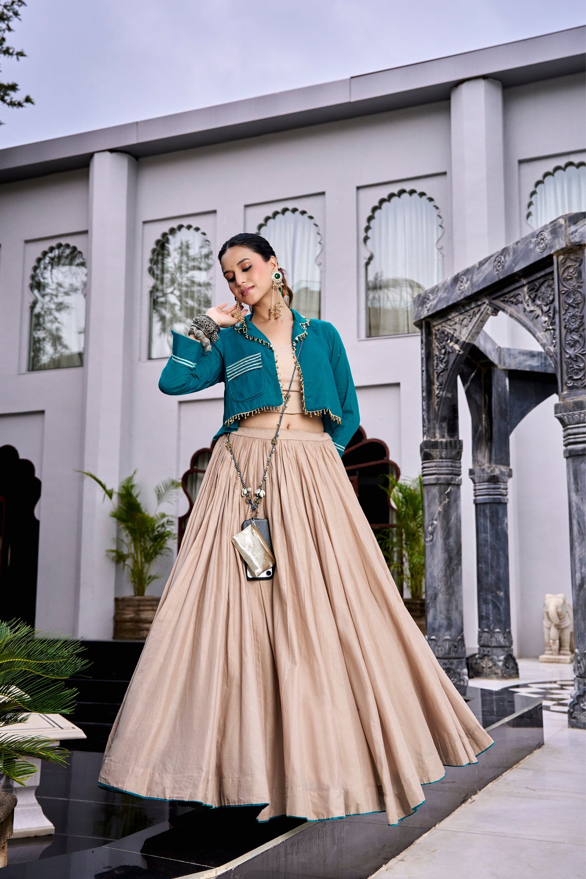 Teal Jacket-Style Crop Top With Beige Flared Lehenga And Matching Purse