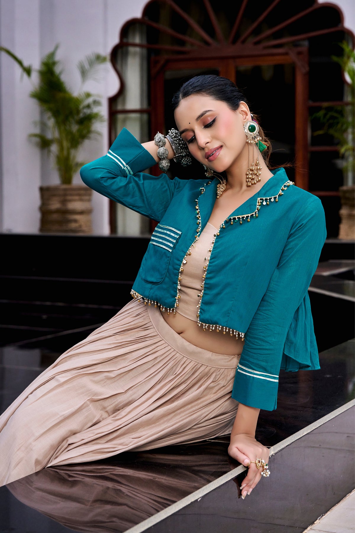 Teal Jacket-Style Crop Top With Beige Flared Lehenga And Matching Purse