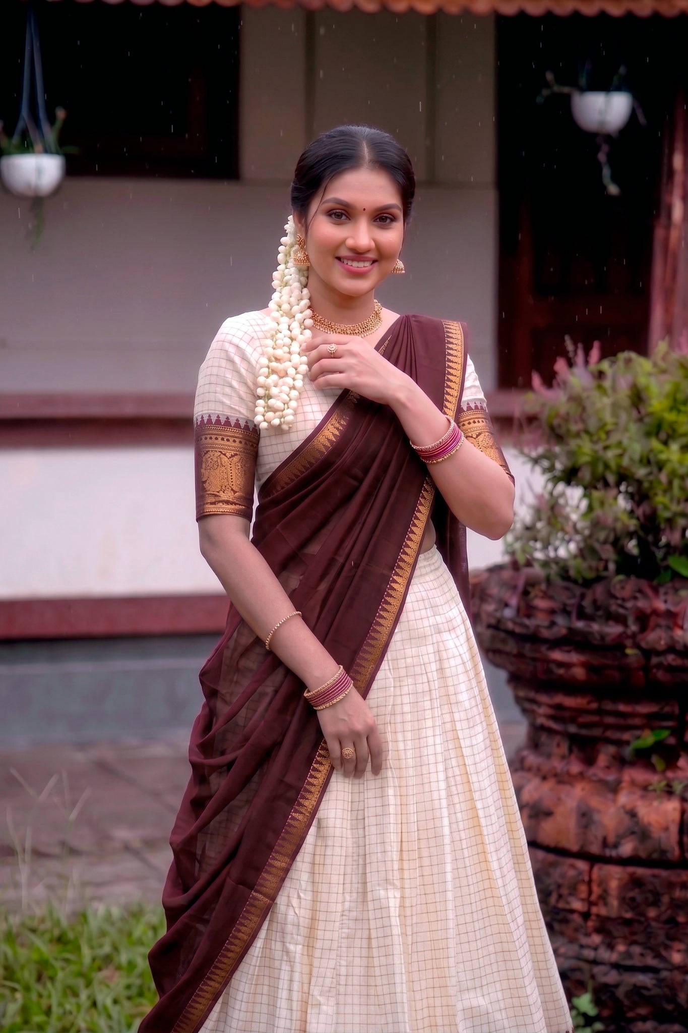 Woman in a traditional lehenga standing 